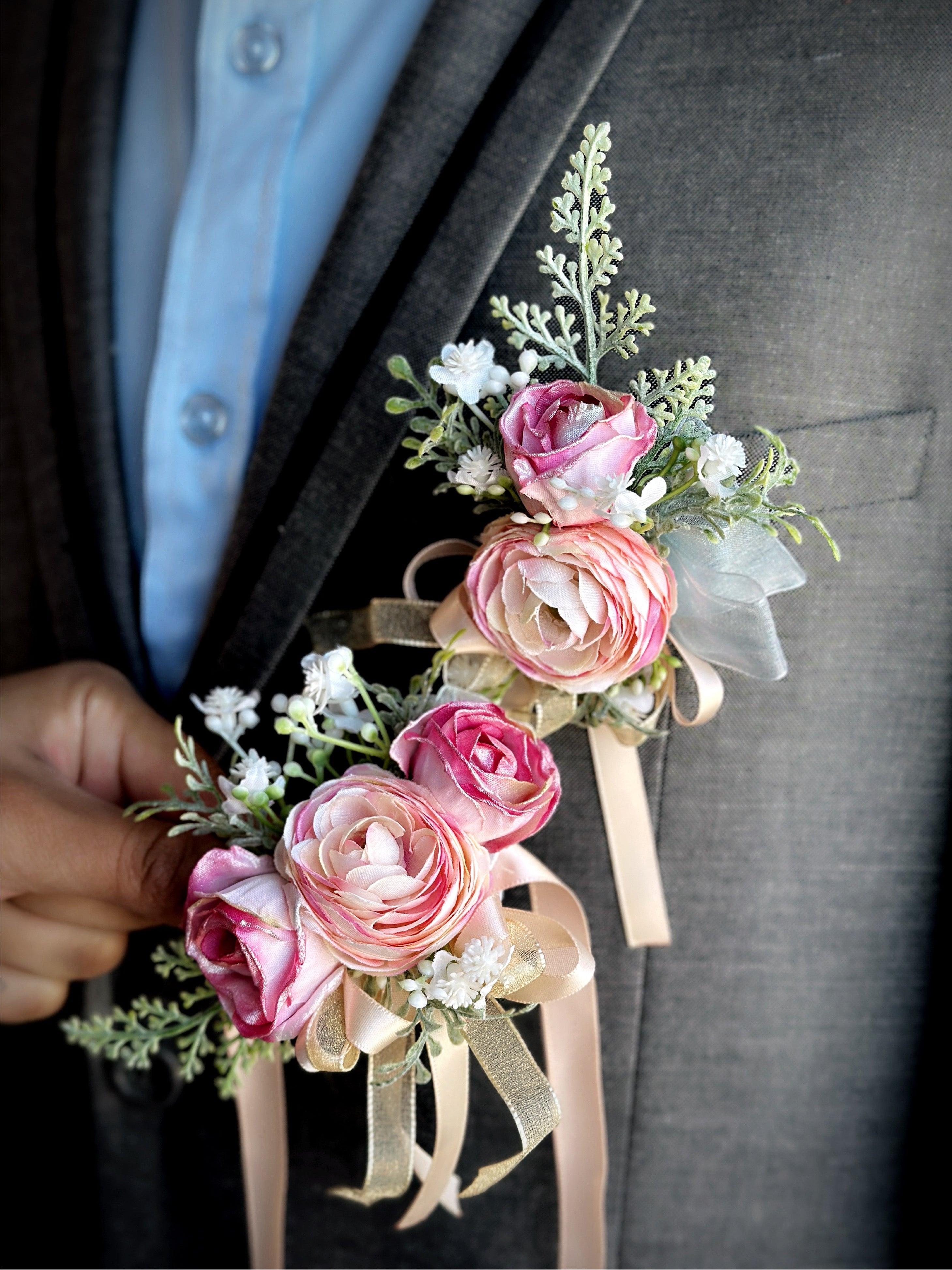Elegant prom boutonniere and corsage set with soft florals and greenery.