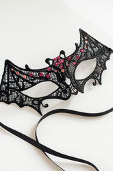 Black bat lace masquerade mask with red rhinestones, gothic Halloween eye mask for women, perfect for vampire balls, masquerade parties, and Halloween costumes.