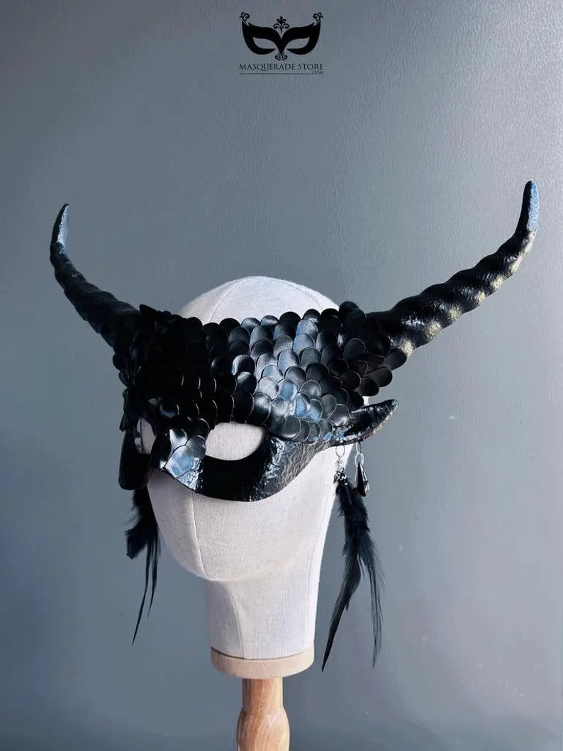 Fantasy black dragon masquerade mask with curled horns and feathers.