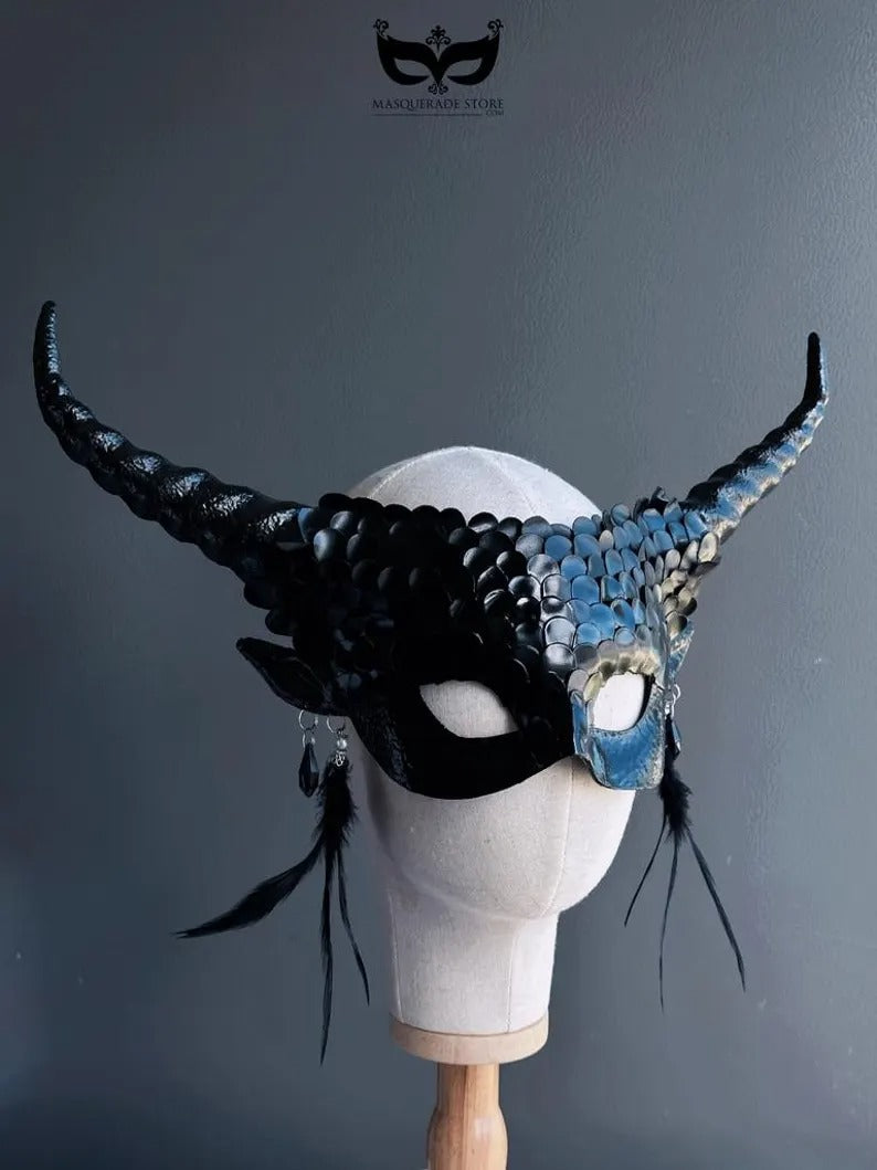 Fantasy black dragon masquerade mask with curled horns and feathers.