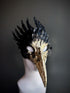 Black and gold bird mask with sculpted feather details and a long beak, perfect for masquerades, fantasy events, and theatrical performances.