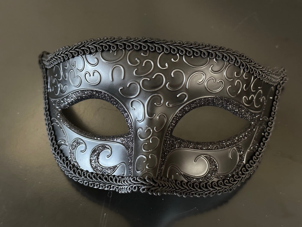 Black Venetian masquerade mask for men with glitter accents and swirl detailing.