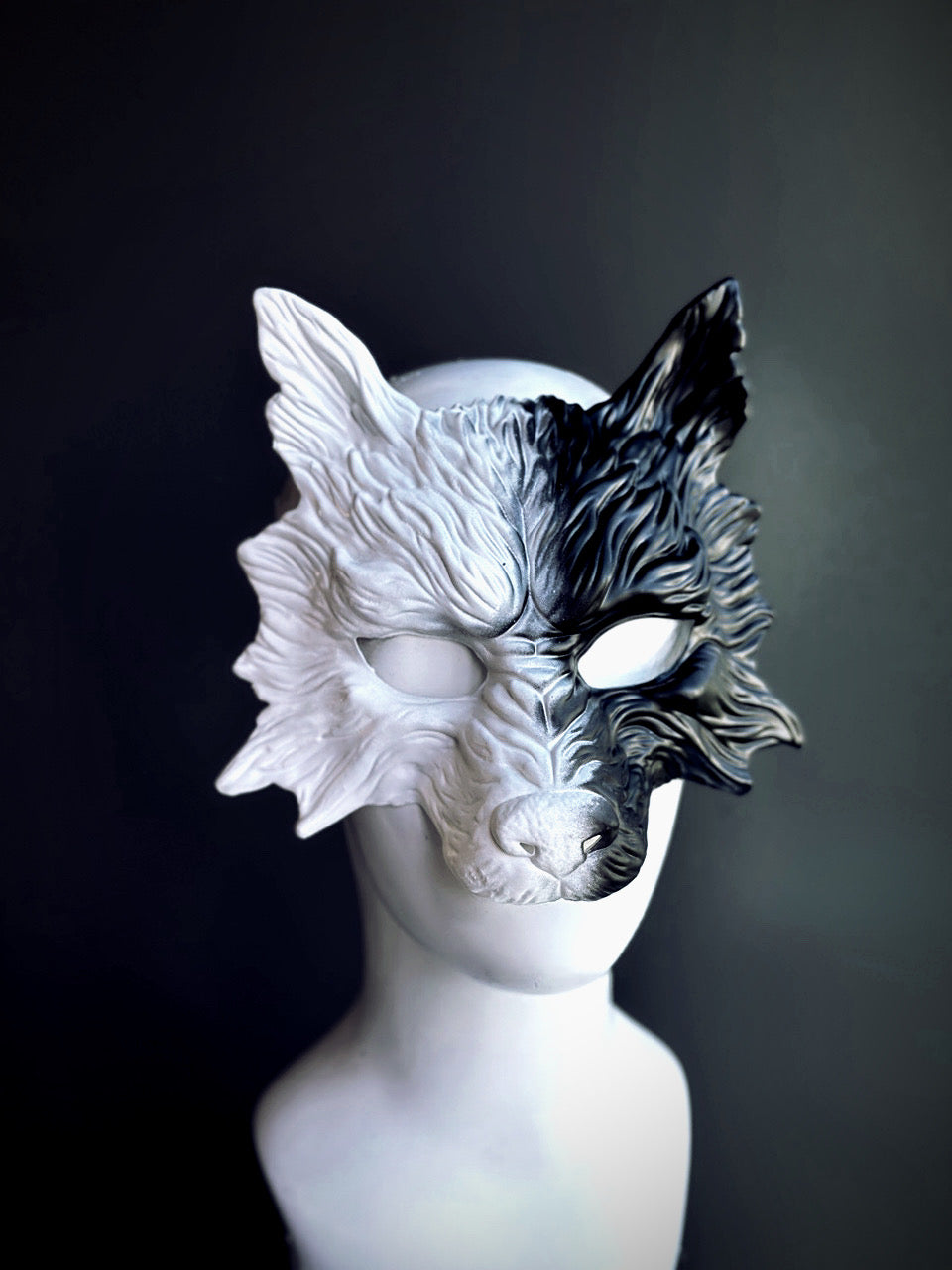 Black and white werewolf mask with sculpted fur texture and a half-and-half color split, perfect for Halloween and fantasy-themed events.