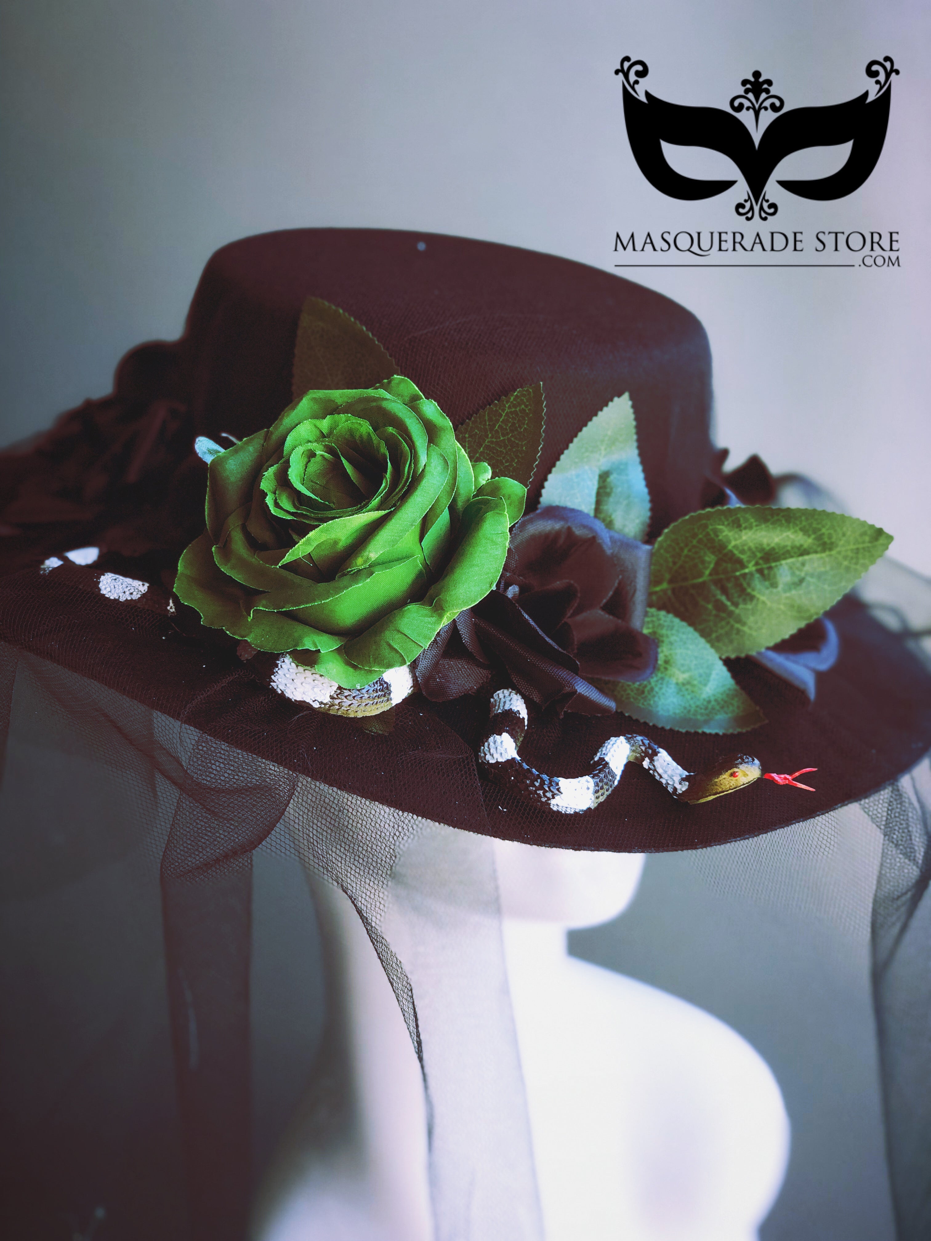 Black widow hat with green rose, lifelike snake accent, and dramatic veil, perfect for Halloween or gothic-themed events.