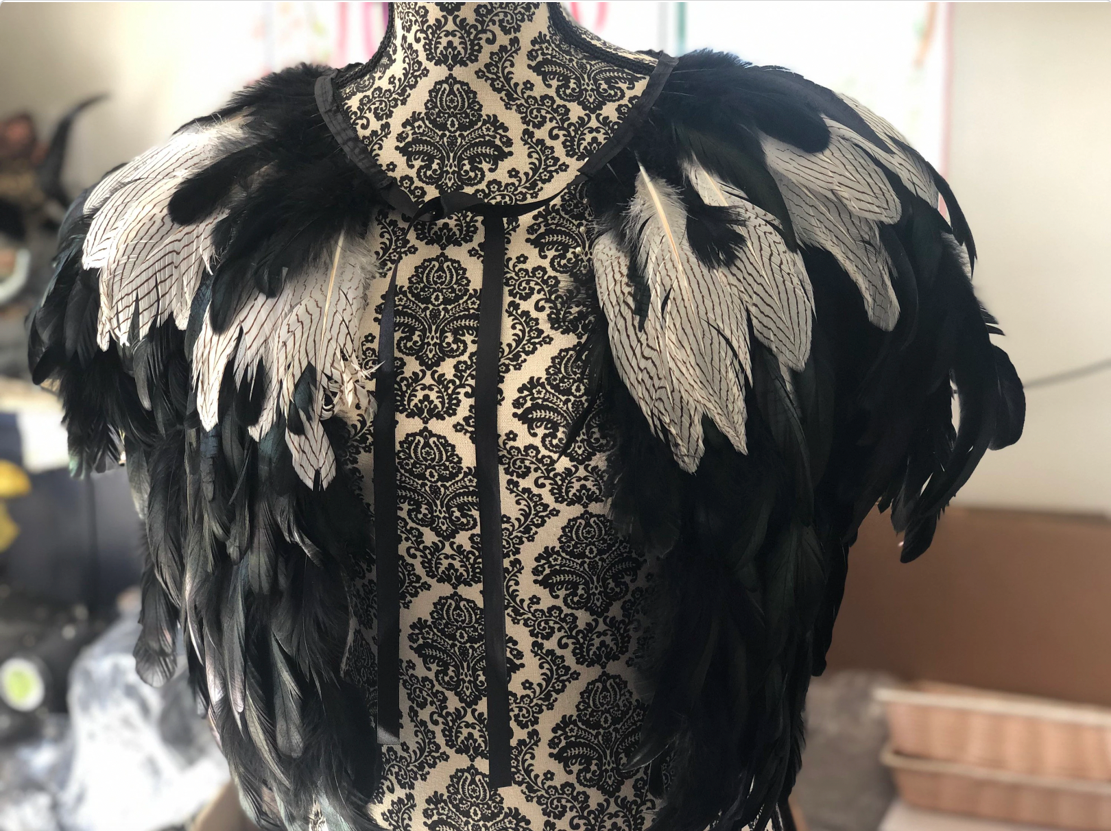 viking feather cape close up