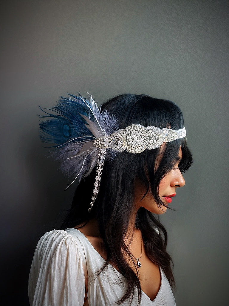 Blue and silver flapper headband with crystals, rhinestones, and feathers, perfect for Gatsby-themed events.