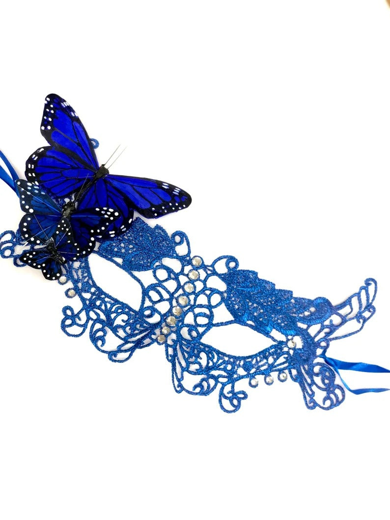 Elegant blue lace masquerade mask with butterfly and rhinestone accents for women’s Venetian parties and balls.