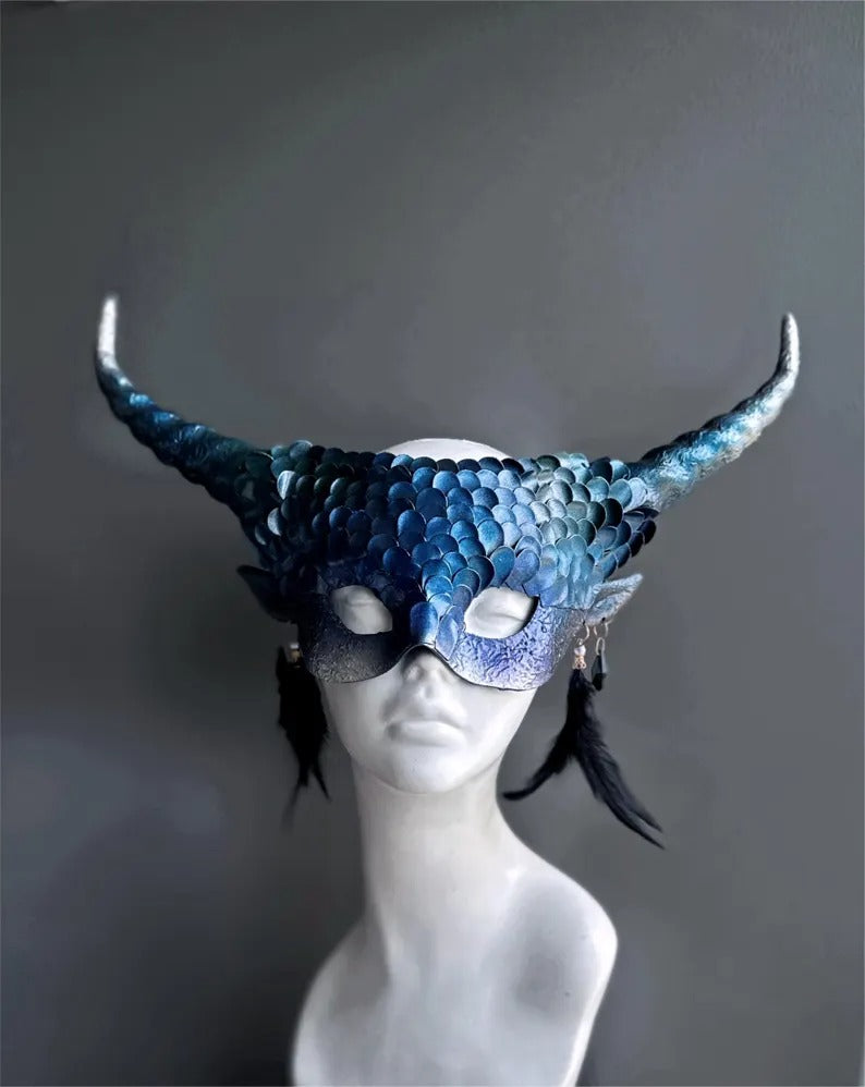 Fantasy blue dragon masquerade mask with curled horns and feather accents.