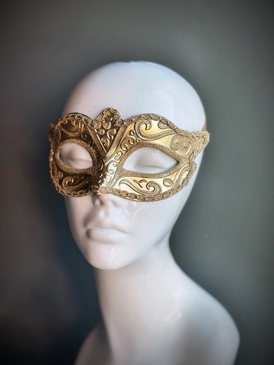 Gold Venetian-style masquerade mask with intricate baroque filigree design