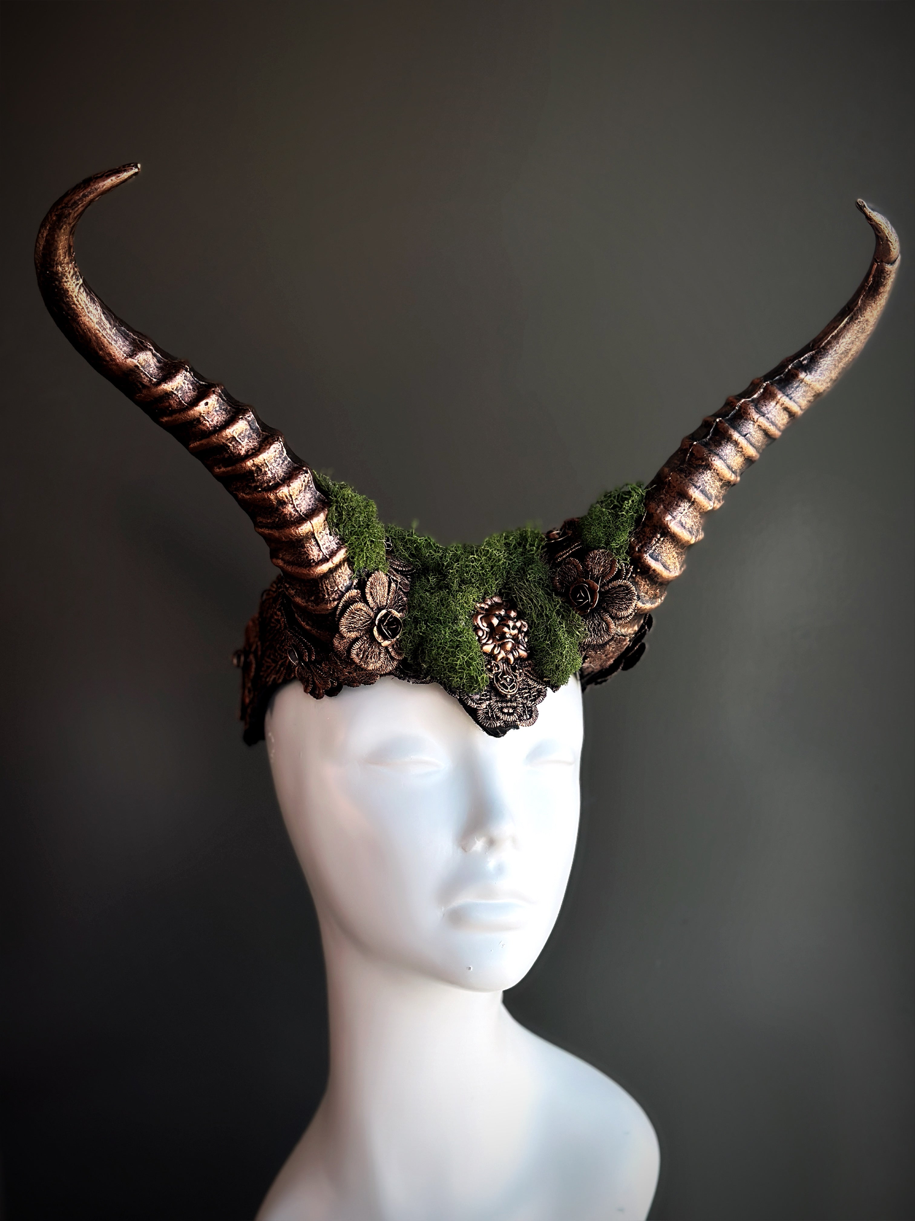 Copper horned headpiece with green moss, perfect for gothic, fantasy, and festival styling.
