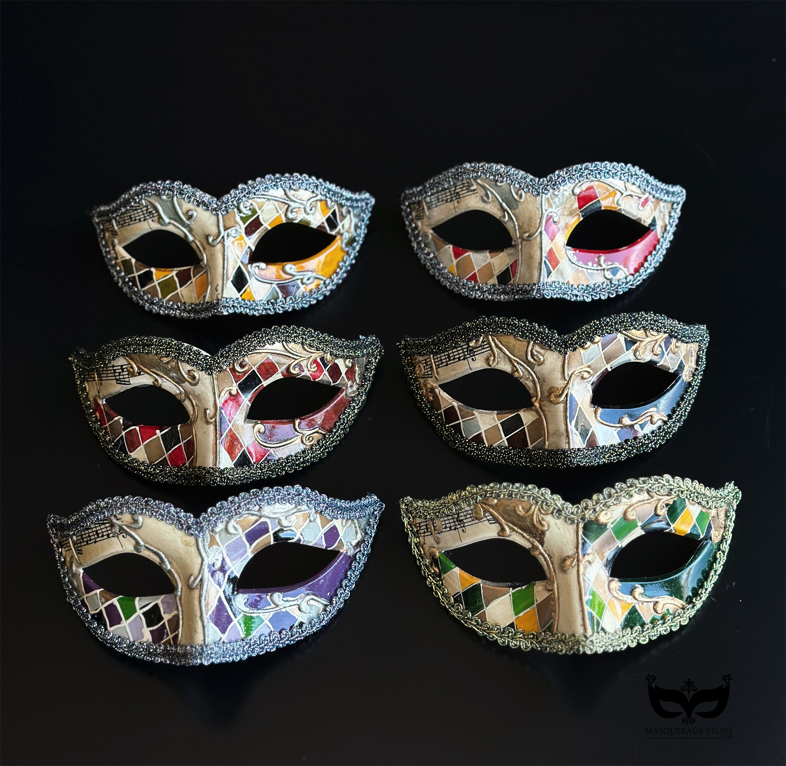 Bulk Venetian masquerade masks featuring colorful mosaic artwork, musical note details, glitter trim, and antique finishes for Mardi Gras parties, weddings, masquerade balls, and large events.