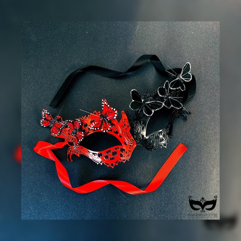 Butterfly masquerade mask with lace design and 3D butterfly accents in red and black.
