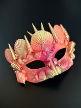 Coral and gold seashell masquerade mask with starfish details for ocean-themed events.