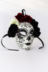 White sugar skull mask with red and black floral crown.