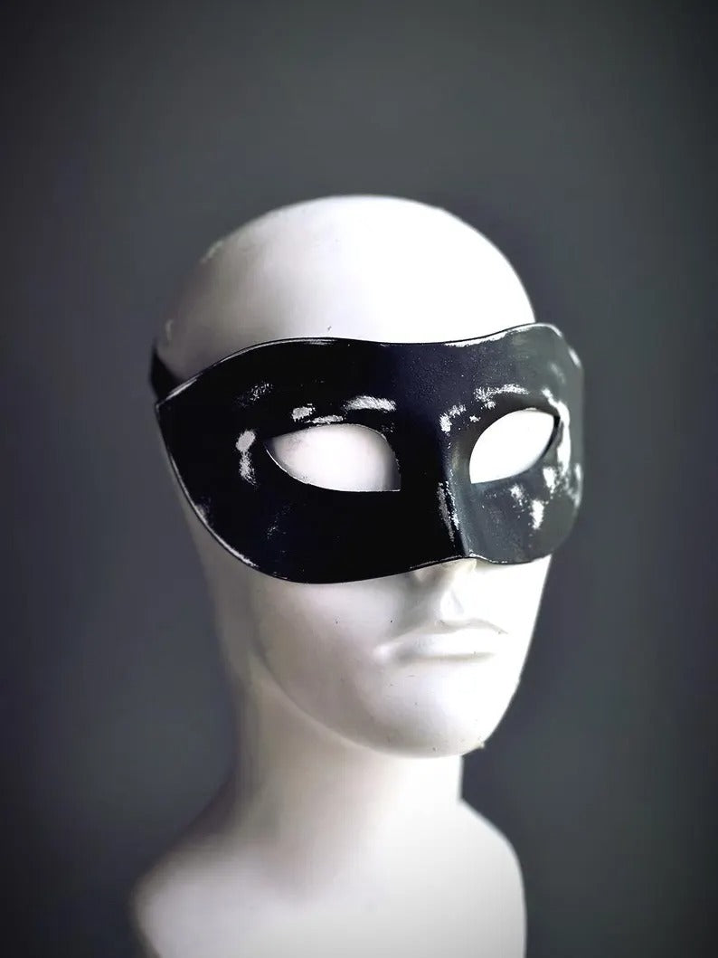 Men’s distressed black Venetian masquerade mask with vintage worn leather effect.