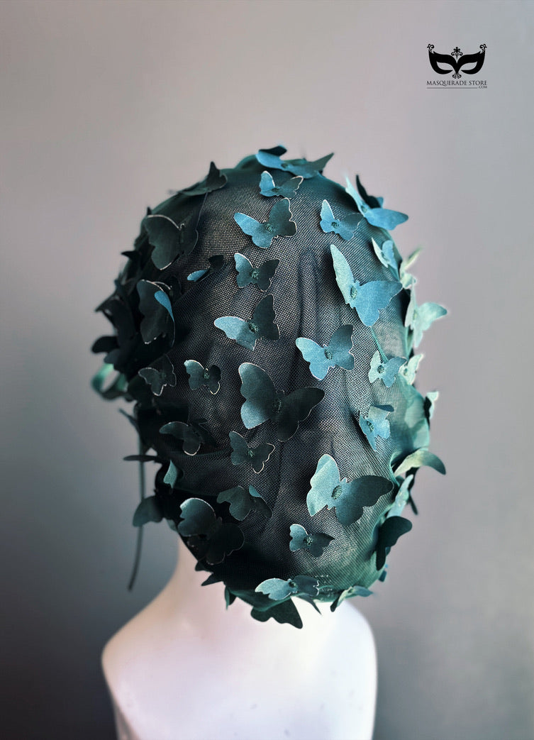 Emerald green butterfly face veil mask featuring dimensional butterfly appliqués attached to a sheer mesh hood, creating a couture-inspired avant garde fashion accessory for runway shows, cosplay, artistic performances, fantasy photoshoots, and fashion editorials.