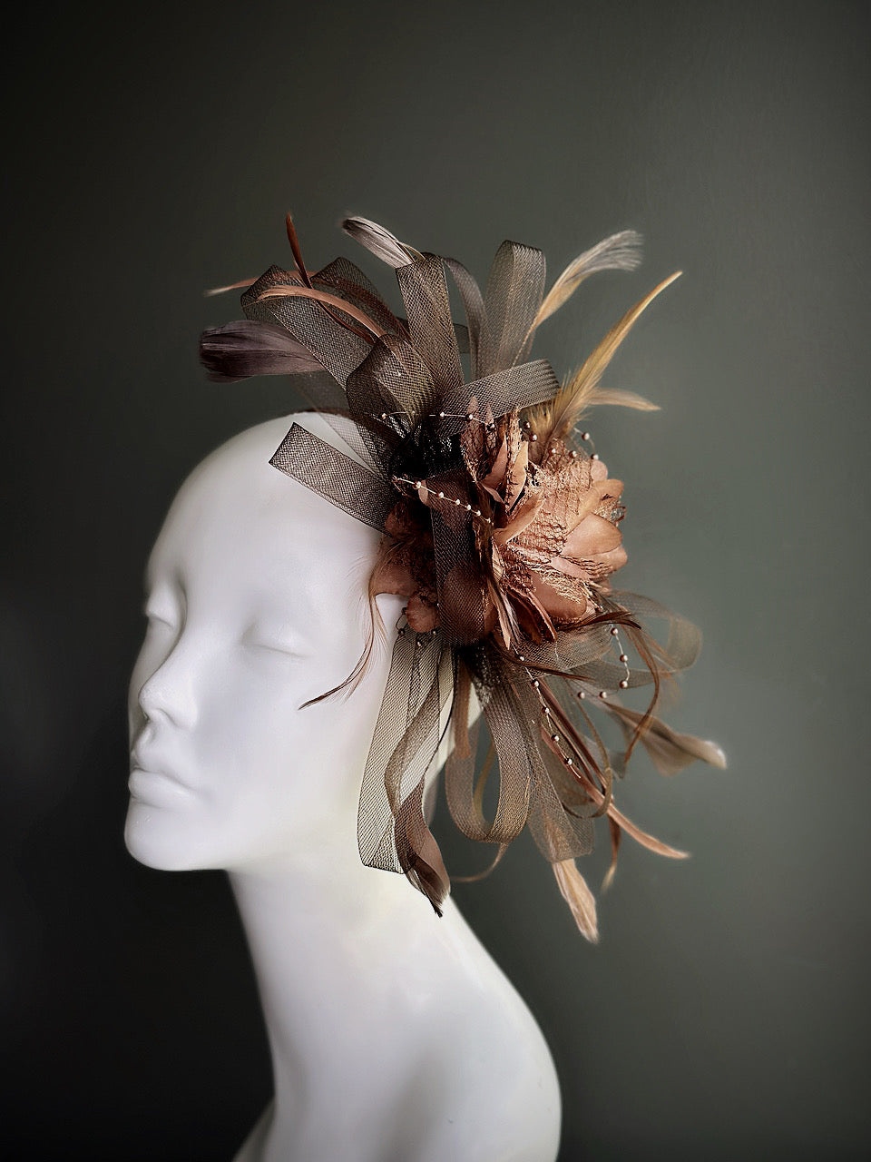 brown fascinator hat with feathers and tulle loops