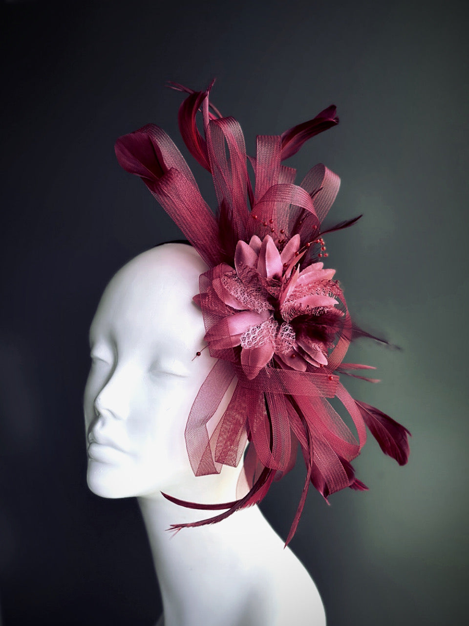 wine red fascinator hat with sculpted tulle ribbons and feather accents