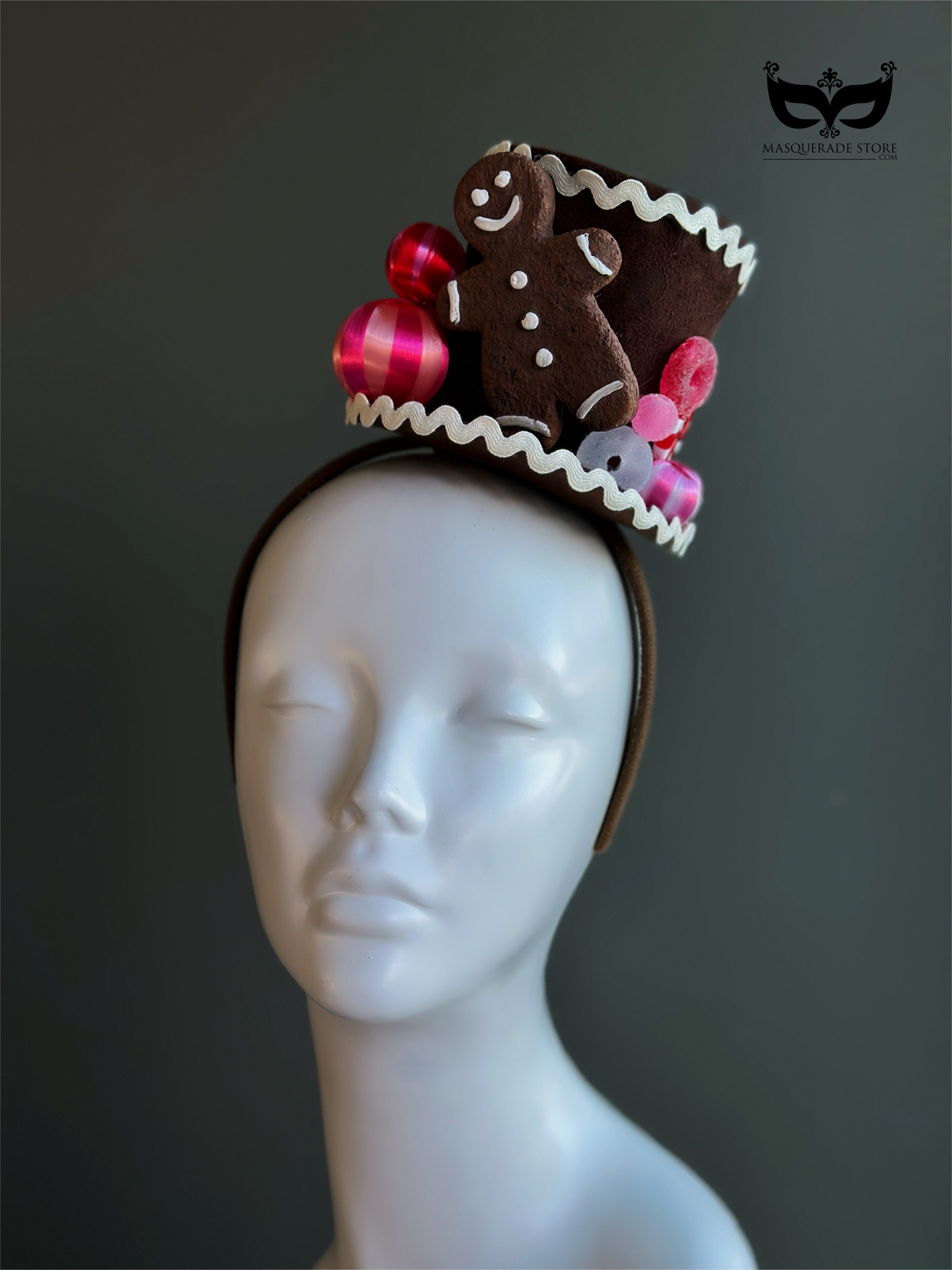 Gingerbread cookie Christmas mini top hat fascinator with festive candy on a top hat headband
