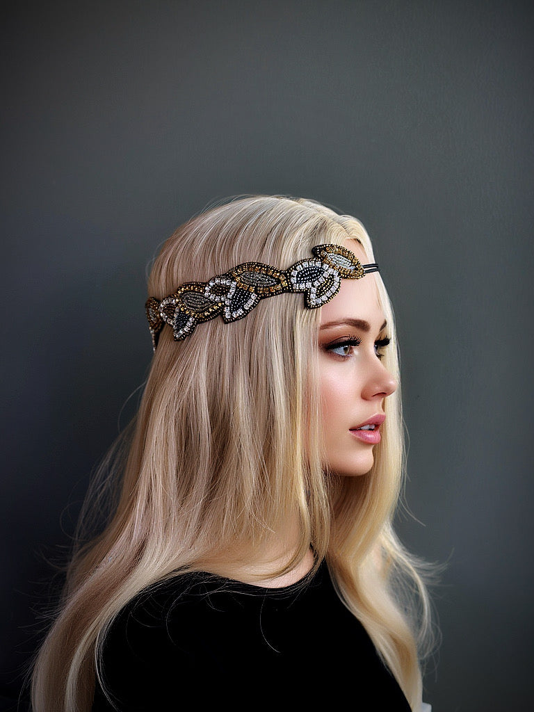 Gold and black beaded flapper headband with a leaf design, perfect for Gatsby-themed parties and elegant occasions.