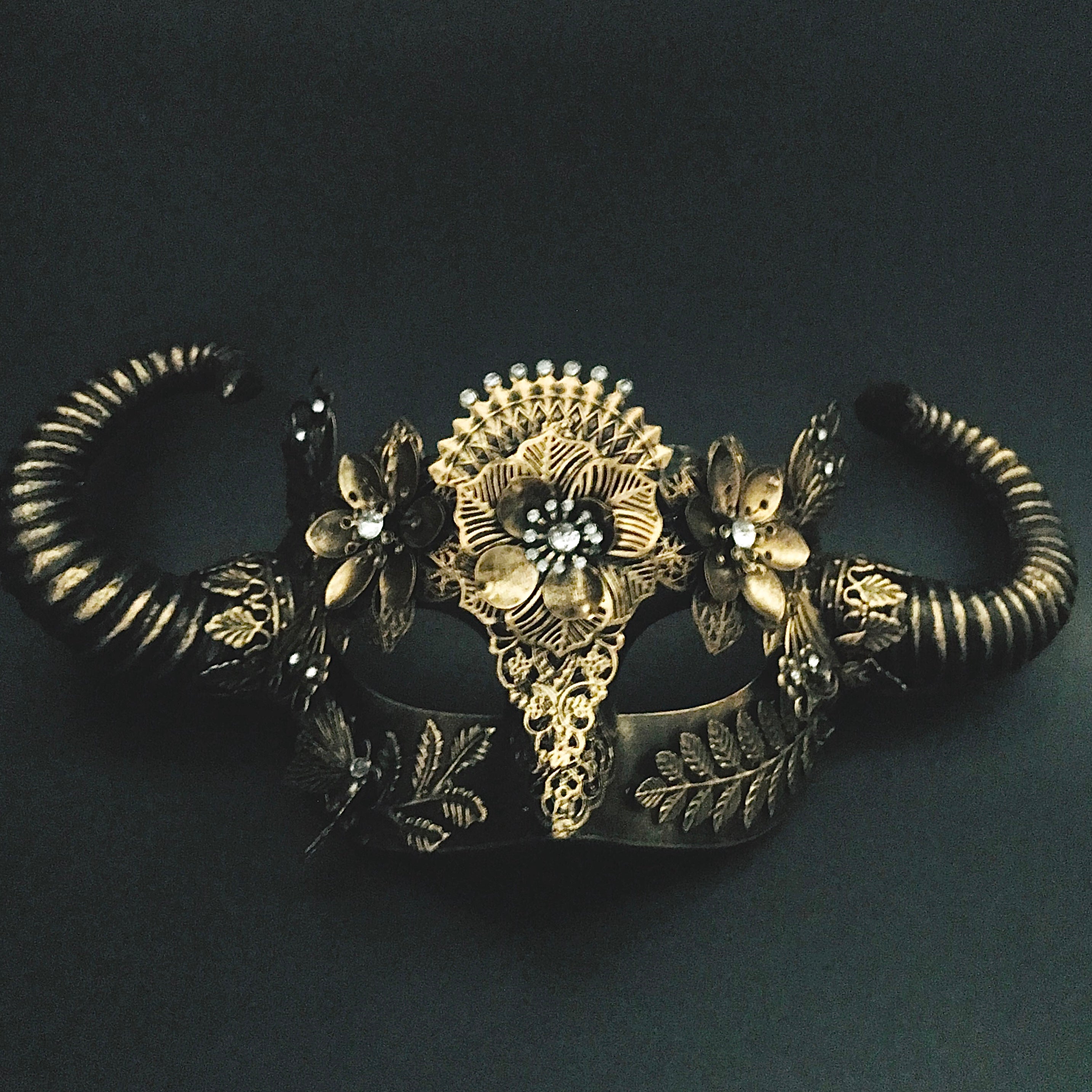 win Horned masquerade mask with intricate floral and filigree detailing