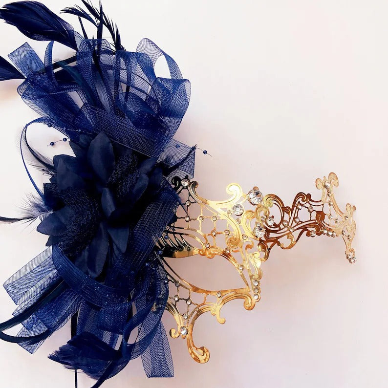 Gold filigree masquerade mask with navy feathers and rhinestones, ideal for weddings, Venetian balls, and masquerade parties.