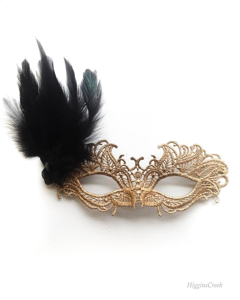 Gold lace masquerade mask with black feather accent, perfect for Venetian-inspired weddings, balls, and masquerade parties.