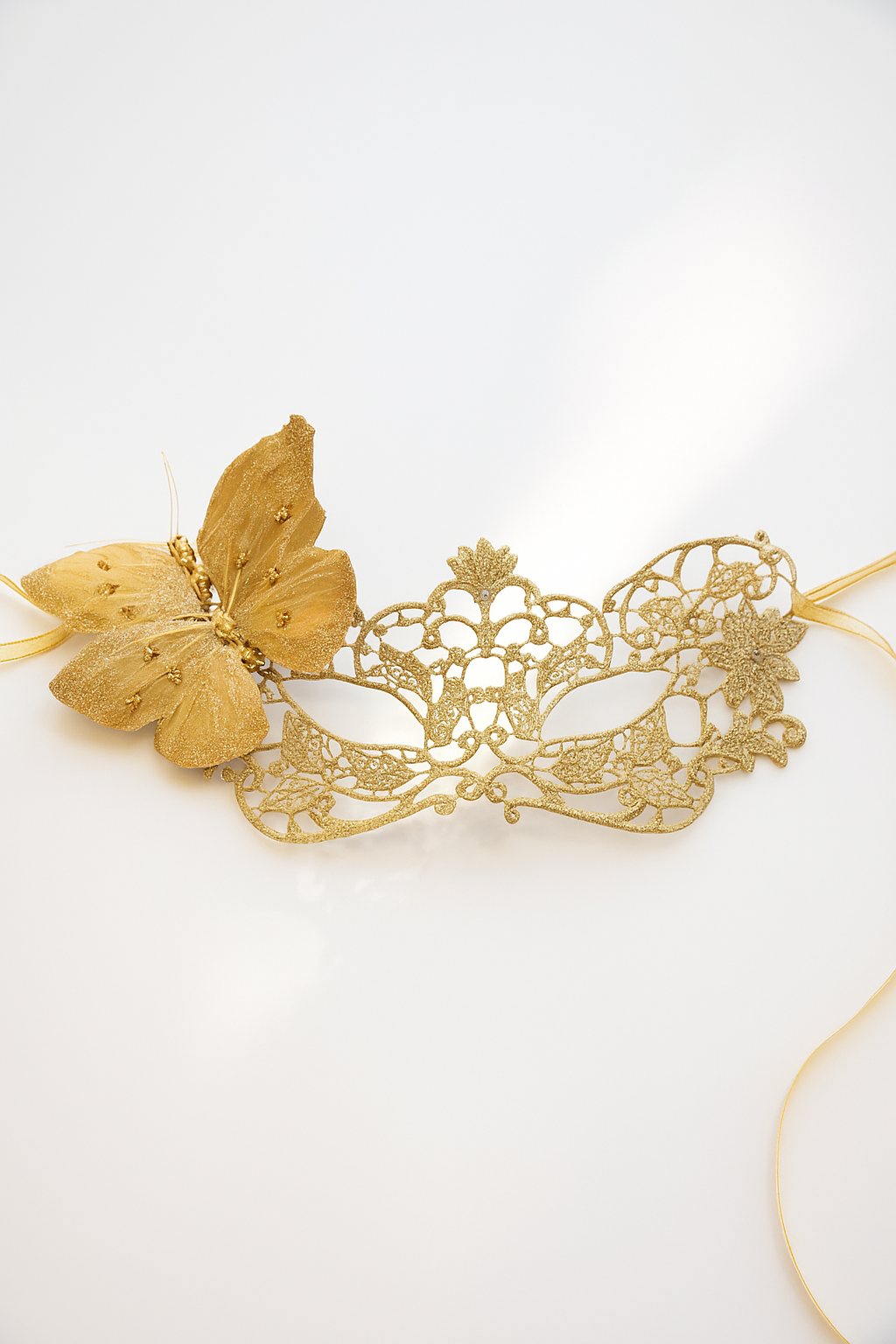Elegant gold lace masquerade mask with glitter butterfly accent, perfect for prom, masquerade balls, and costume parties.