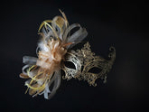 Elegant gold lace masquerade mask with feathers, rhinestones, and floral accents for women, ideal for balls and proms.