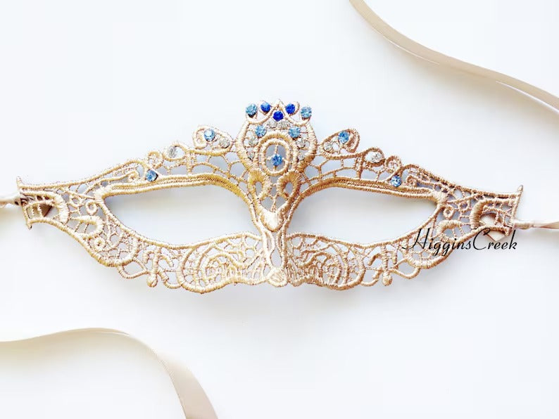 Elegant gold lace masquerade mask with sparkling blue rhinestones, Venetian-style lace eye mask for women, ideal for weddings, Halloween, prom, and masquerade parties.