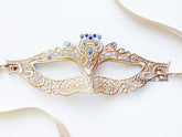 Elegant gold lace masquerade mask with sparkling blue rhinestones, Venetian-style lace eye mask for women, ideal for weddings, Halloween, prom, and masquerade parties.