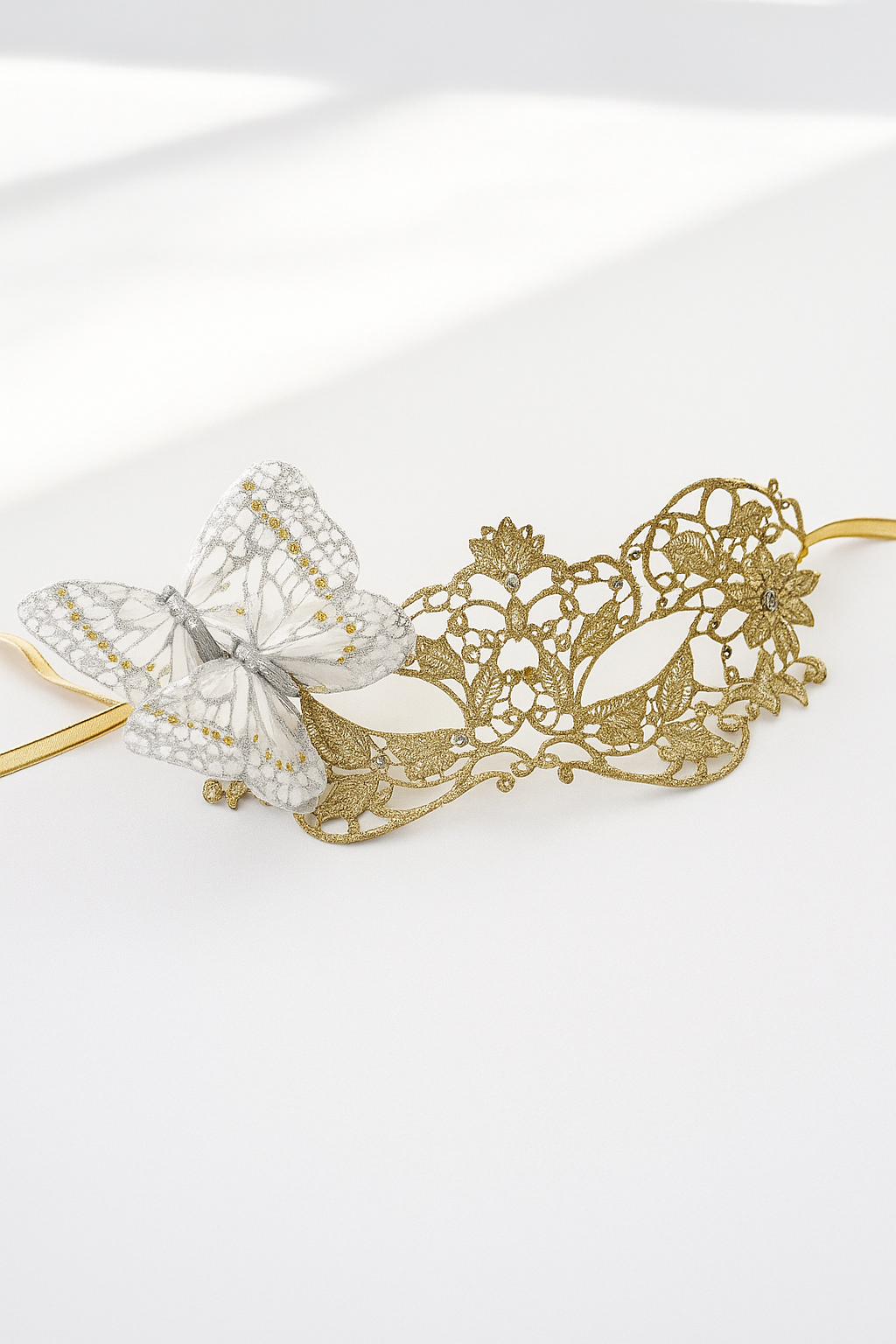 Elegant gold lace masquerade mask with silver glitter butterfly accent, perfect for proms, masquerade balls, and costume parties.