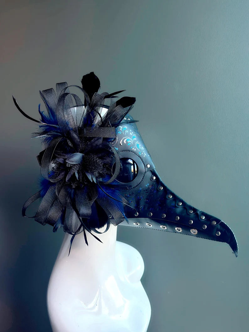 Blue faux leather plague mask with black and blue feathers, perfect for Halloween or gothic masquerades.
