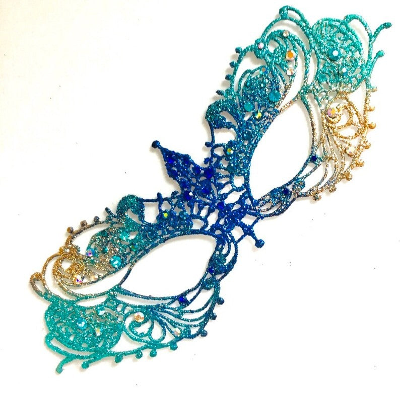 Venetian handheld masquerade mask with peacock feathers, jeweled details, and blue feather plumes.