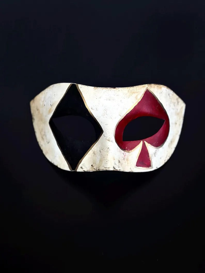 Venetian Harlequin masquerade mask with distressed ivory finish, black diamond, and red spade design, perfect for Carnival and Halloween.