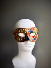 Harlequin Venetian masquerade mask with colorful diamonds and gold accents for Carnival, Mardi Gras, and masquerade balls.