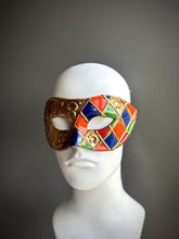 Harlequin Venetian masquerade mask with colorful diamonds and gold accents for Carnival, Mardi Gras, and masquerade balls.