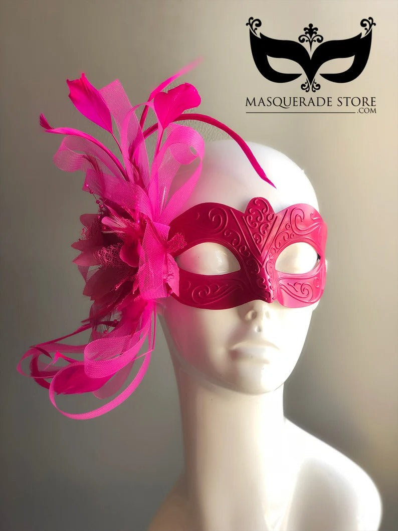 Hot pink Venetian masquerade mask with feather and tulle plume accent.