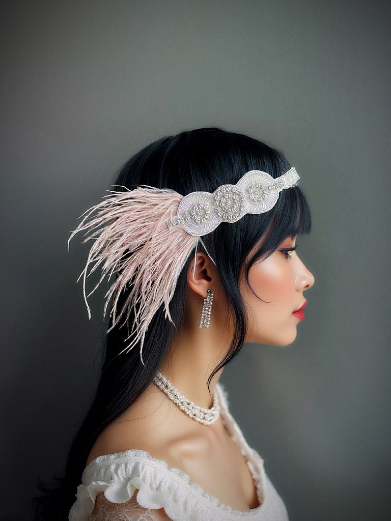 Ivory flapper headband with beaded crystal design and feathers, perfect for Gatsby-themed parties and elegant occasions.
