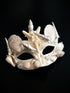 Ivory masquerade mask decorated with seashells, starfish, and pearls in a mermaid-inspired ocean theme.