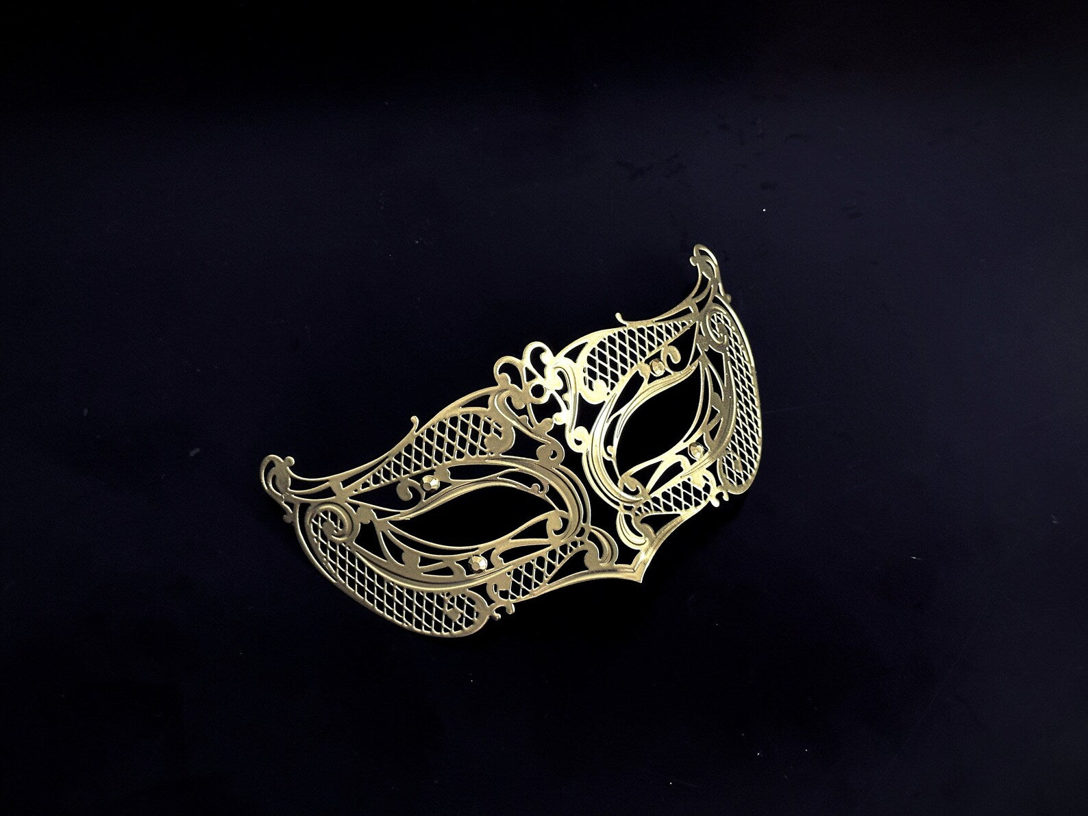 Kids gold metal masquerade mask with intricate cutout designs, perfect for costume parties and themed events.