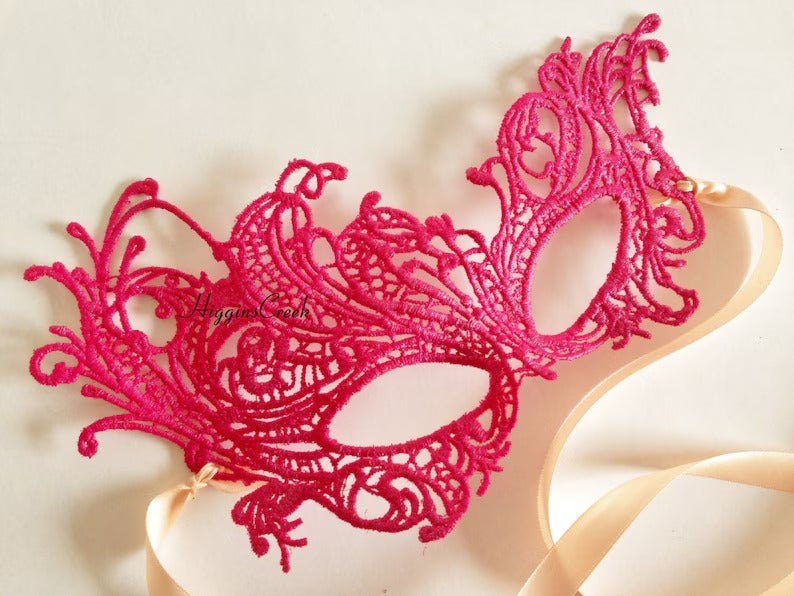 Hot pink lace masquerade mask for kids with satin ribbons, perfect for girls’ parties, costumes, and playful dress-up.