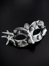 silver masquerade mask with shells and starfish