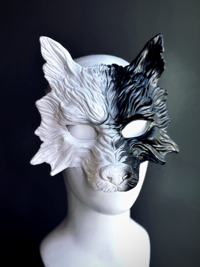 Wolf mask in half black and half white.