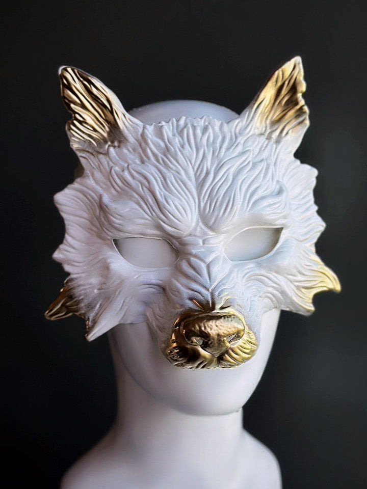 Wolf masquerade mask in white with golden ears and snout.