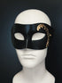 Black masquerade mask base with a gold hand-painted design on the side.