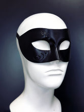 Black masquerade mask base with black hand-painted design.