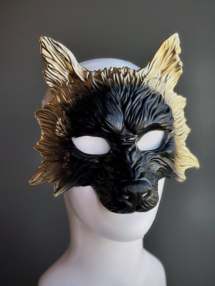Black wolf mask with gold edges.