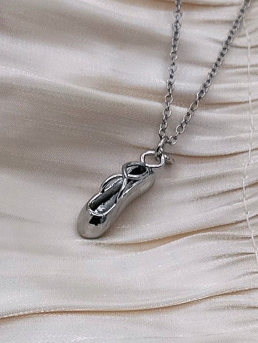 Silver ballet slipper necklace on a silver plated chain.