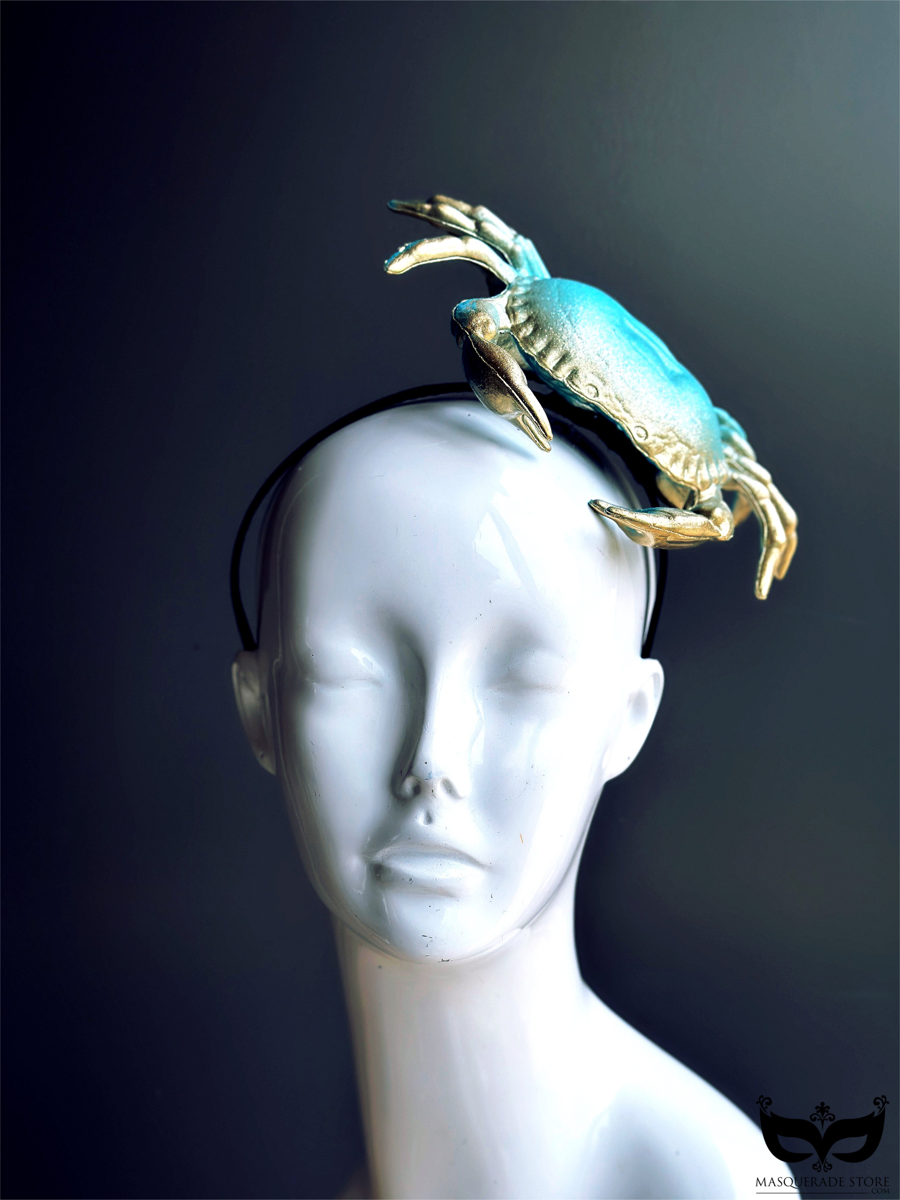 Unique turquoise and gold crab fascinator on a sleek headband, ideal for ocean-inspired fashion, beach events, and statement looks.